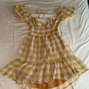 Yellow ruffle dress with open tie back